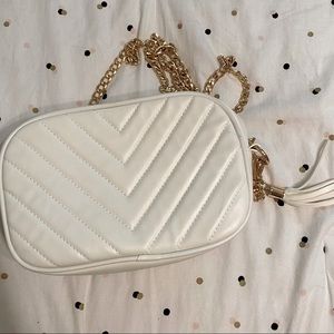 white bag with gold chain